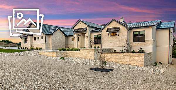 Luxury custom home in Spring Branch TX with modern Hill Country architecture and black metal roof