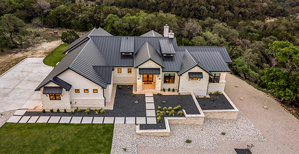 Three-car garage exterior of a luxury custom home built by Stone Creek Custom Homes in Spring Branch Texas